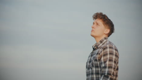 male farmer contemplating outdoors