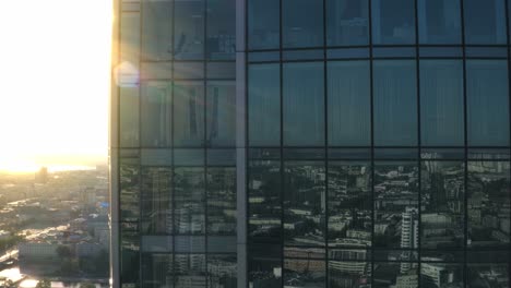 city view reflected in skyscraper windows