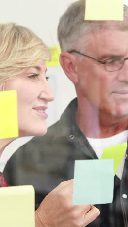 creative businessman looking at post-it