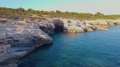 Incredible-drone-view-of-a-cliff-diving-spot-into-the-ocean