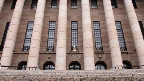 Classical-architecture-of-Helsinki-Parliament-House,-grand-columns,-daytime,-no-people,-wide-shot-slow-zoom-in