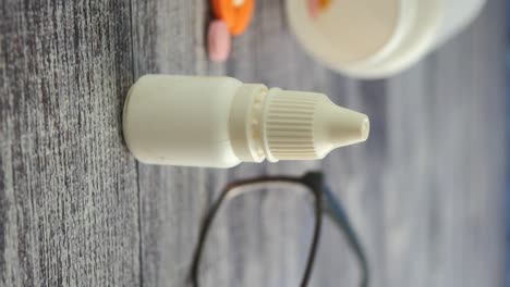 eye drops, glasses, and pills