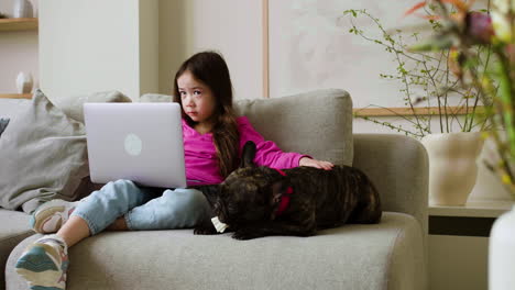 Girl-petting-dog-at-home