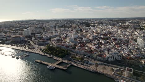 aerial panorama view, portimão downtown city buildings riverfront, algarve