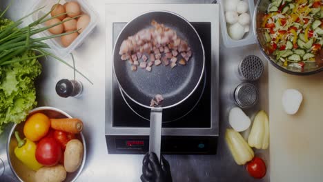 cooking bacon in a pan