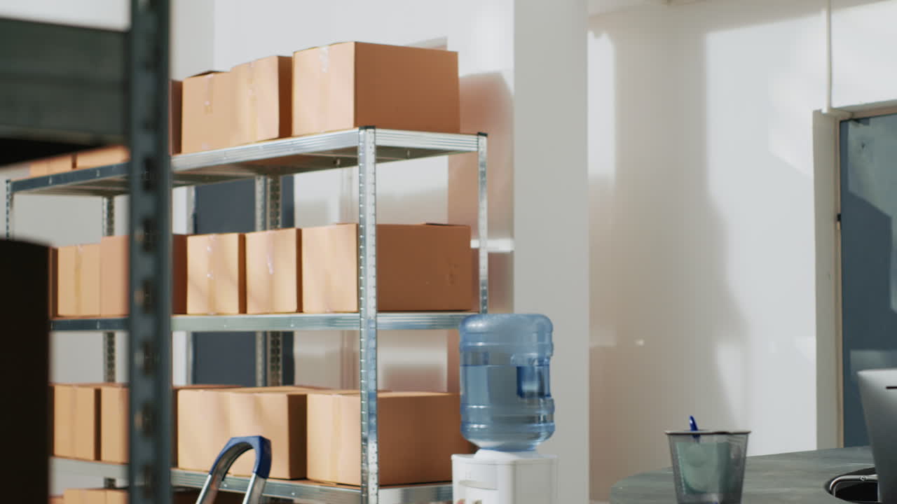 Warehouse worker handling cardboard boxes