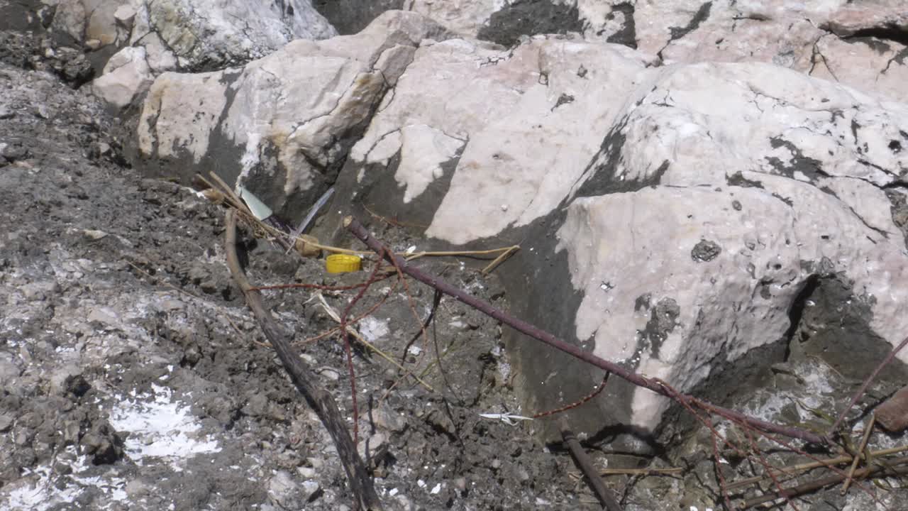 Close-up view of rocks, soil, and debris