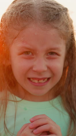 girl revels in cooling embrace of rain closeup. child excitement for rain grows with laughter ringing out like bells in tranquil riverside air