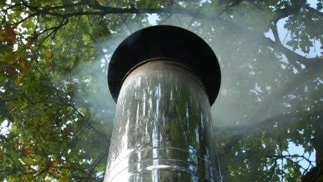 hot steam fume smoking out chrome conduct of hot sauna, close up