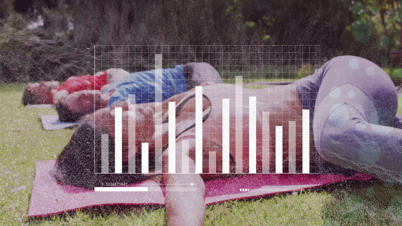 Relaxing on grass, people viewing data visualization animation on screen outdoors