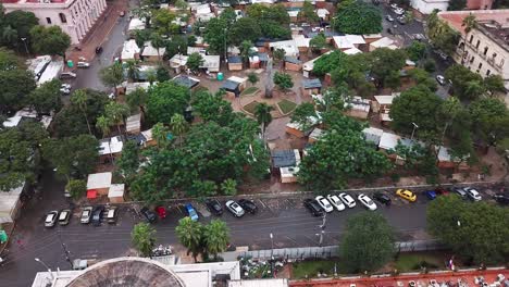 camera capturing a panoramic view of a south american shanty town partially submerged by flood water. poor city.