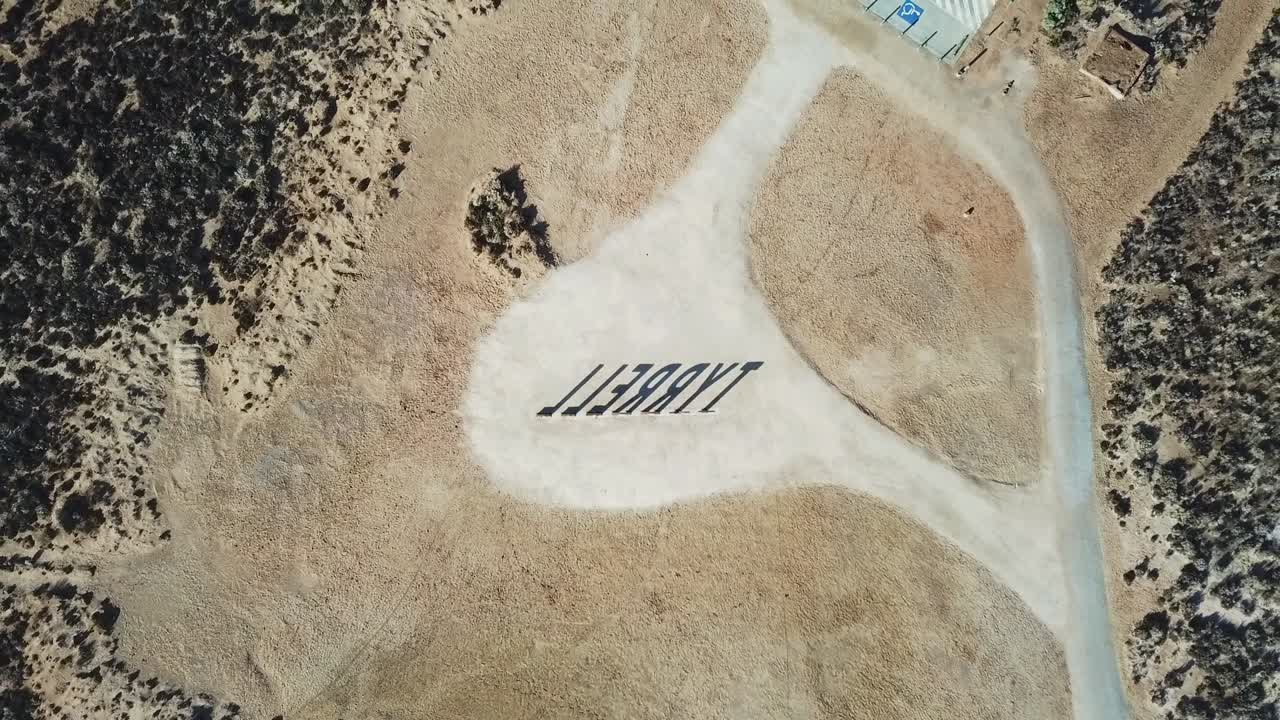 Rising drone footage from above of the sign at Lake Tyrell in north-west Victoria, May 2021.