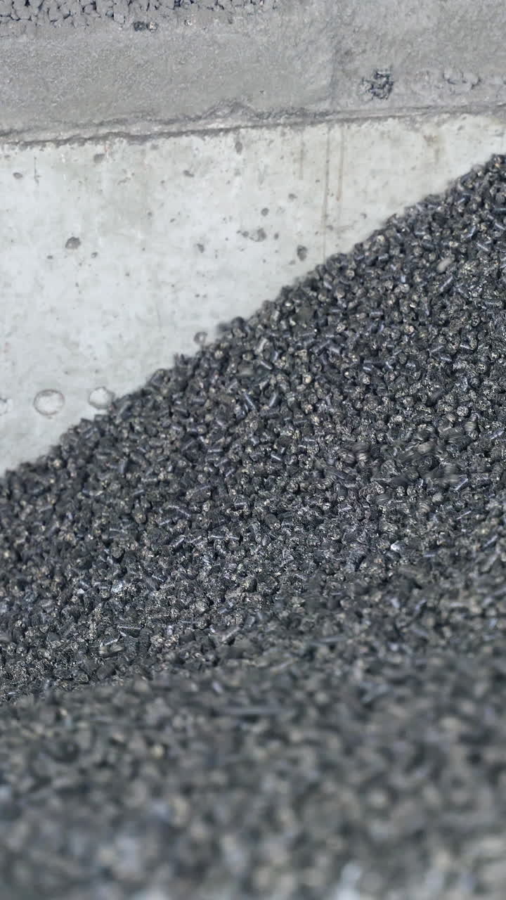 Dark elevator heating chemical coal. Full storage of coal in elevator storage. Vertical video