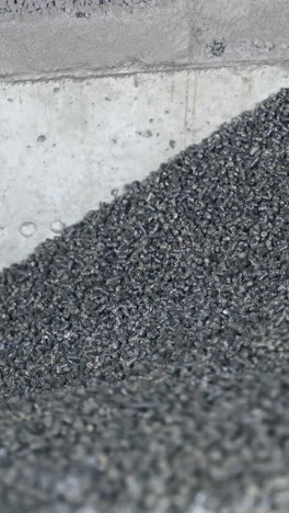 dark elevator heating chemical coal. full storage of coal in elevator storage. vertical video