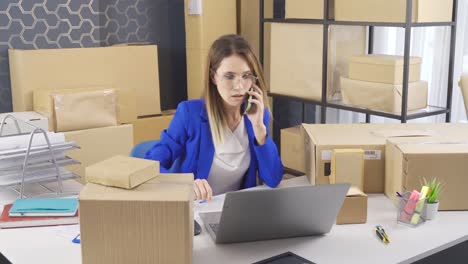 business woman selling in e-commerce takes order on the phone.