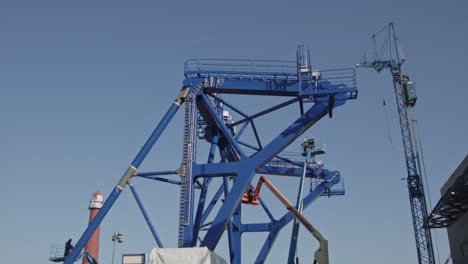 beautiful tilt up of a pre-piling template being constructed at a dock in a harbor. the piling template will be used to place offshore wind turbines in deep water