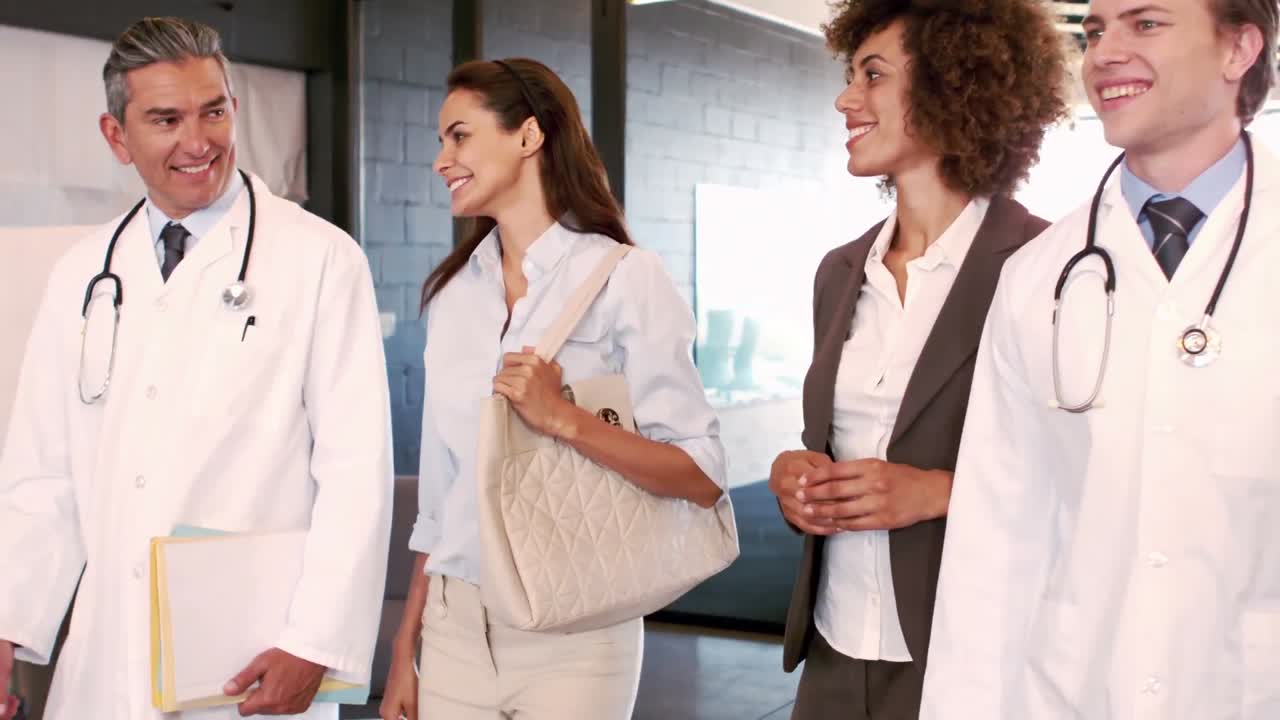 Doctors and businesswomen walking and talking together