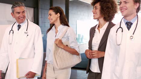 Doctors-and-businesswomen-walking-and-talking-together