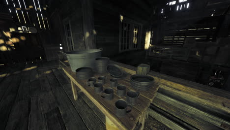 rustic crafts displayed on a wooden table inside a dimly lit workshop