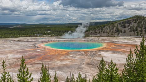 Slow-zoom-time-lapse-of-Grand-Prismatic-Hot-Spring-Geyser-in-Yellowstone-National-Park-on-beautiful-day-with-flowing-puffy-clouds