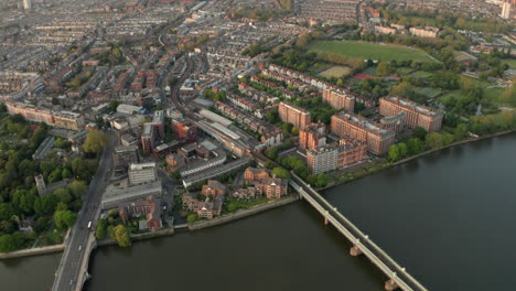 descending aerial shot over putney bridge station