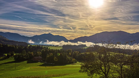 timelapse of clouds moving in the valley and a bright sun in the sky