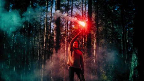 man waving a signal flare in the woods