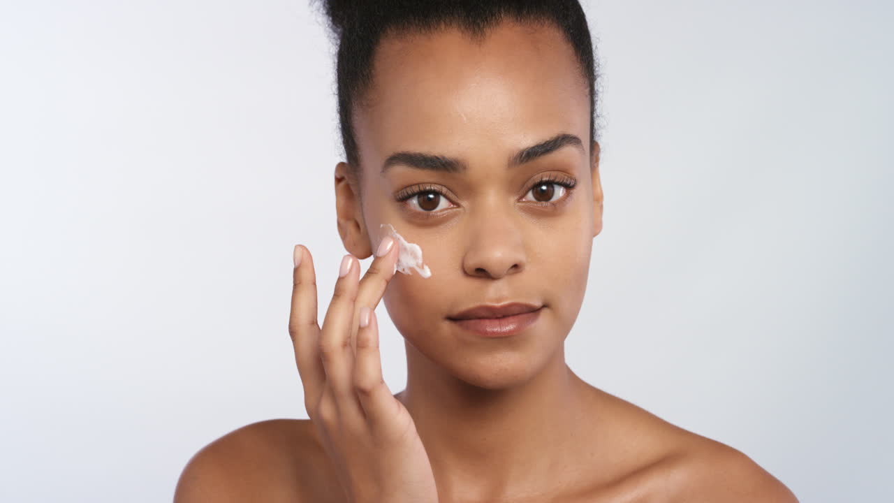 Face, sunscreen and cream on black woman