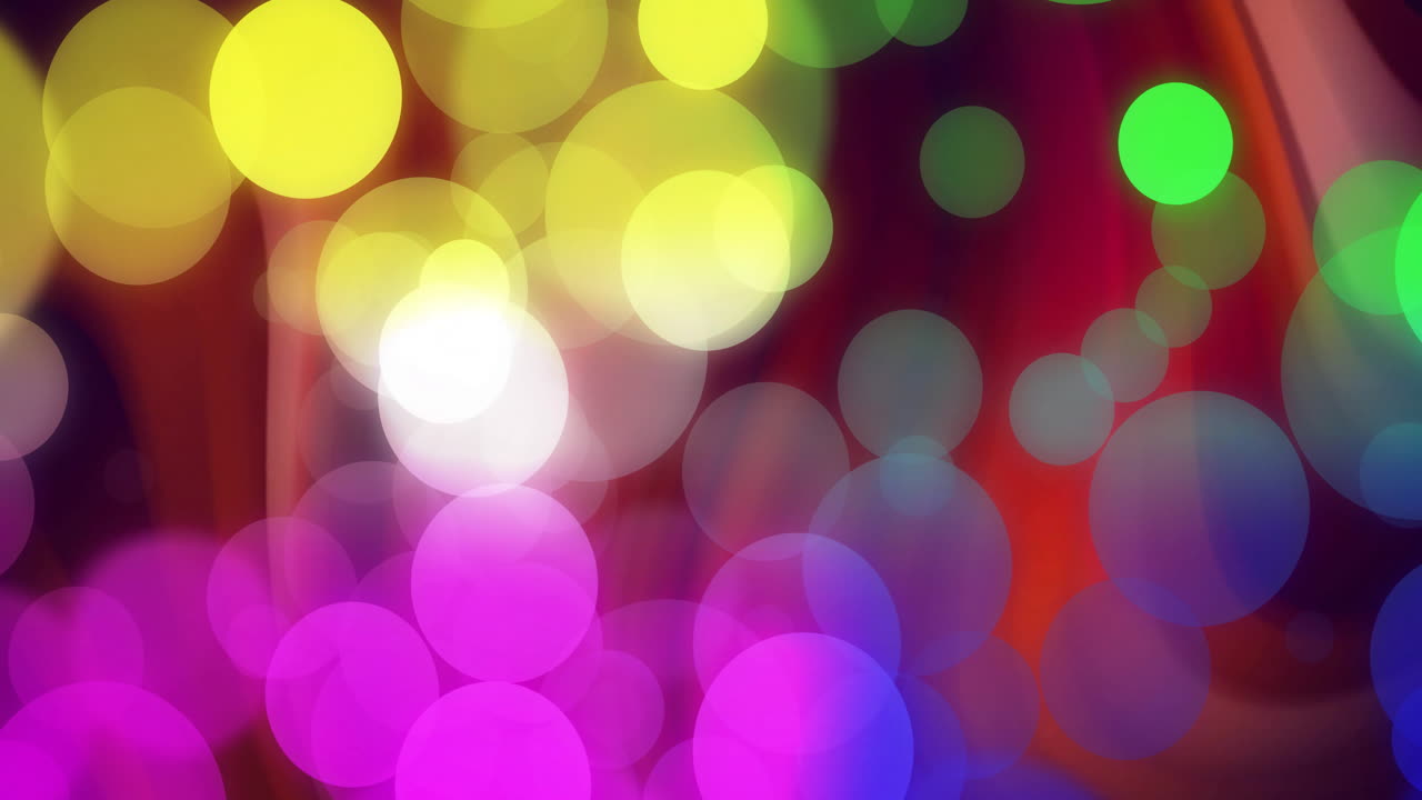 어두운 배경 위에 움직이는 반이는 빛의 반점의 애니메이션