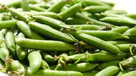 pea pods fresh greens rotating top view pea pods fresh greens rotating top view