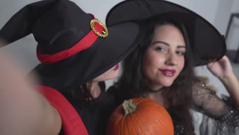 happy halloween selfie with witches and pumpkins