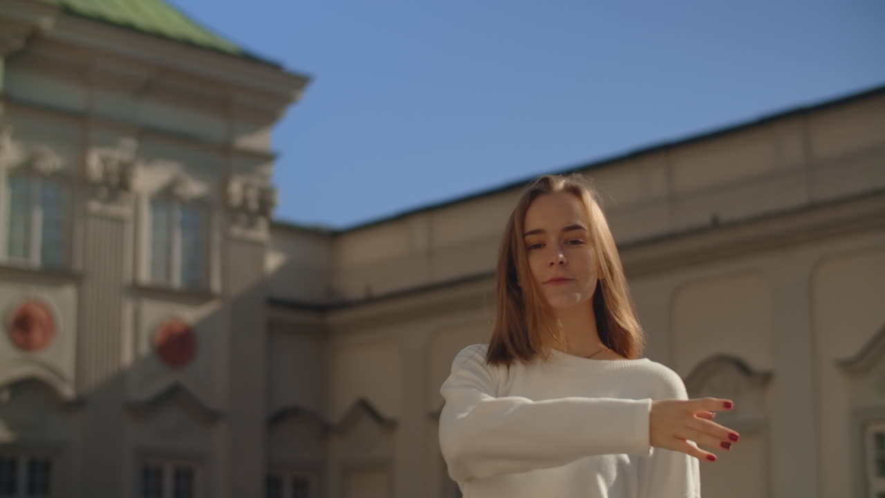 Woman Posing Outdoors in Front of a Palace
