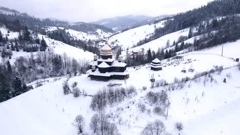 old wooden church on the peak of the hill in small village