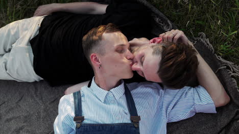 Couple-kissing-on-a-romantic-date-outdoors