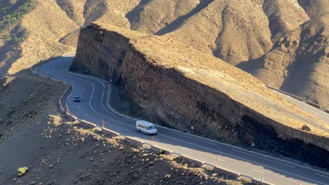 Aerial-view-cars-driving-on-dangerous-road-in-Atlas-Mountain-Range