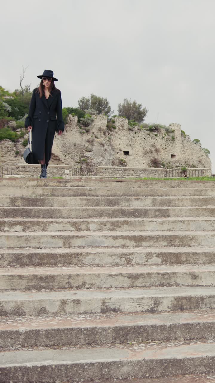 Elegant Woman On High Heels Walking Down The Stairs Of The Town Square