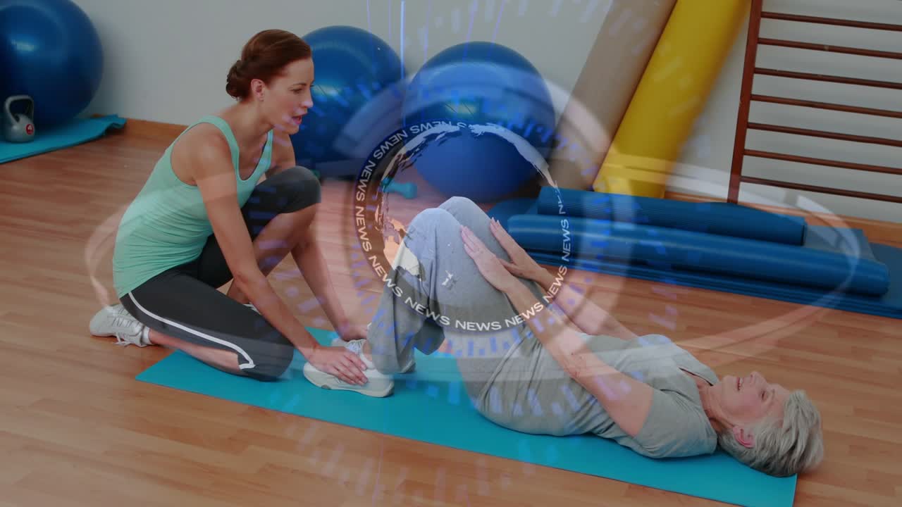 Trainer bracing client feet under towel initiating crunching on teal mat for rehab center watermark