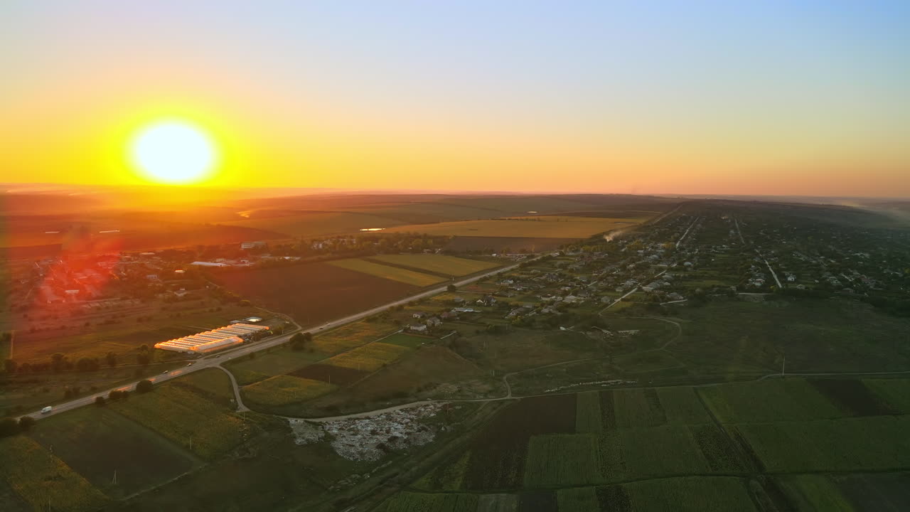 Aerial drone view of nature in Moldova at sunset. Village, road, wide fields