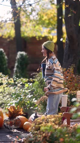 woman enjoying autumn in a garden