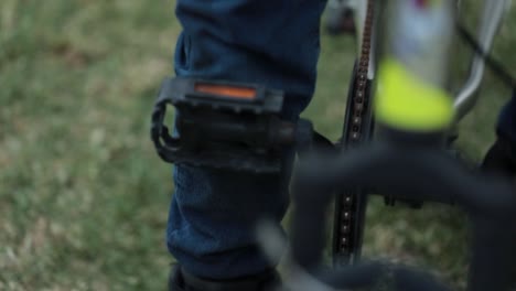 Cinematic-shot-of-a-people's-leg-on-the-paddle-of-a-cycle