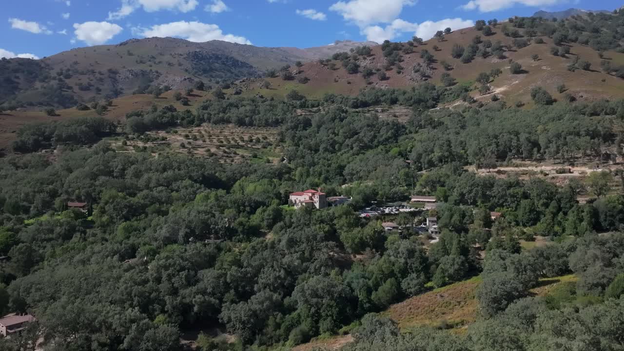 ascending flight with a drone seeing the sanctuary of the Virgin of Chilla from afar, in this way we can appreciate the fabulous environment of the Sierra de Gredos where it is located,