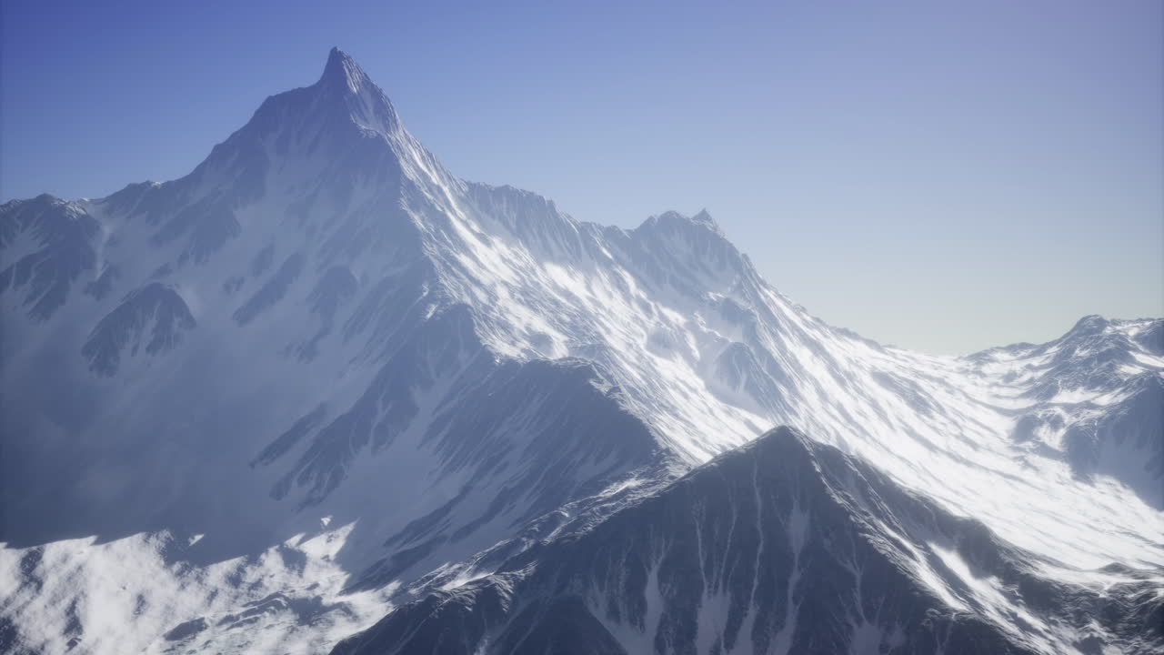 Majestic snow capped mountain range under clear blue sky in daylight