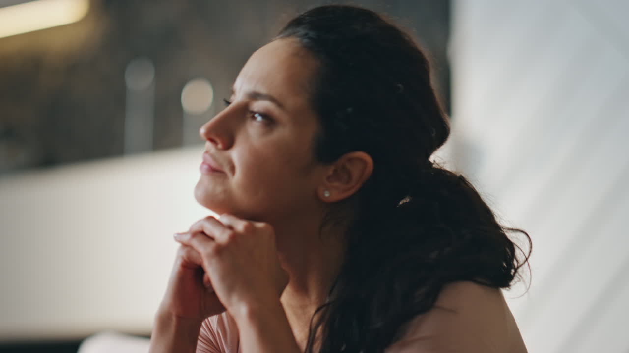 Exhausted woman feeling stress reading bad news at home close up. Worried girl