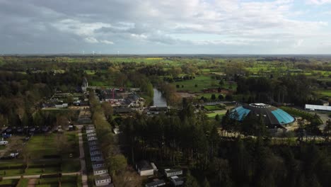 Aerial-4K-Drone-footage-of-of-Les-Ormes-Campsite-showing-the-Dome-Swimming-Pool-and-Surrounding-Pitches