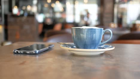 coffee and phone in a cafe