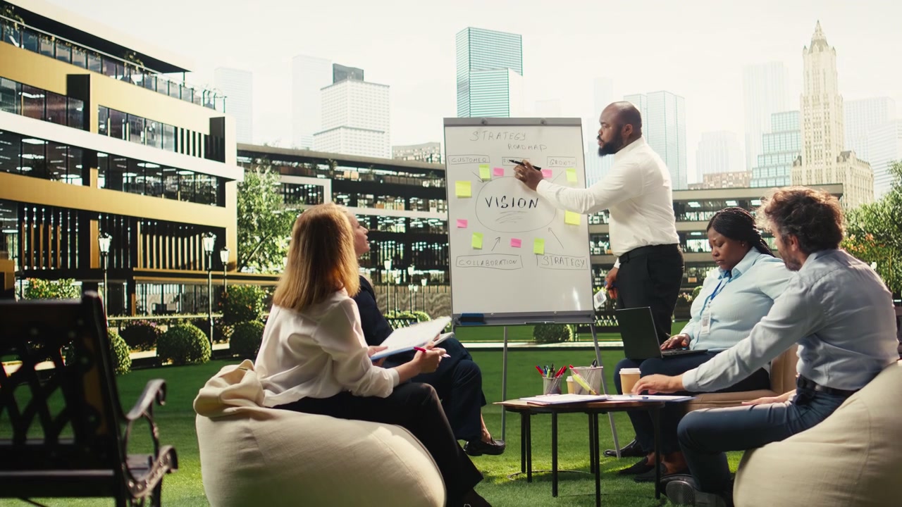 Diverse Business Team Having a Strategy Meeting on an Outdoor Office Terrace
