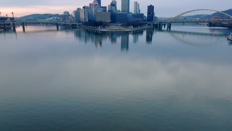 aerial tilt up reveal of point state park and the converge of the allegheny and monongahela rivers into the ohio