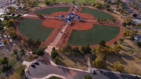 aerial view of a park with baseball fields and parking lot