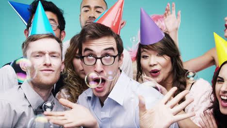 Multi-racial-group-of-happy-people-dancing-with-bubbles-slow-motion-party-photo-booth