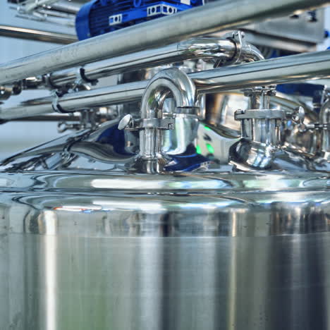modern technology of making organic cheese in the dairy factory. special equipment for making delicious milk products inside the manufacture plant.